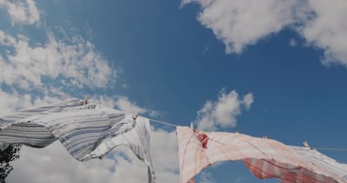 Freshly Washed Clothes Gently Drying on Clothesline