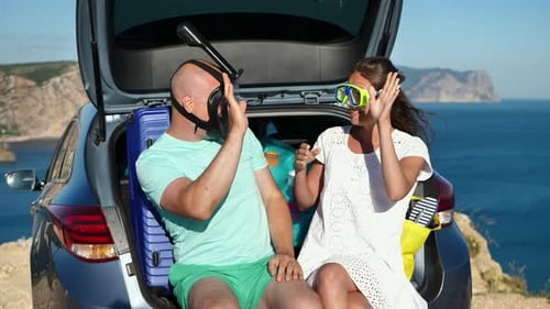 Happy Couple with Snorkels Ready for Ocean Adventure