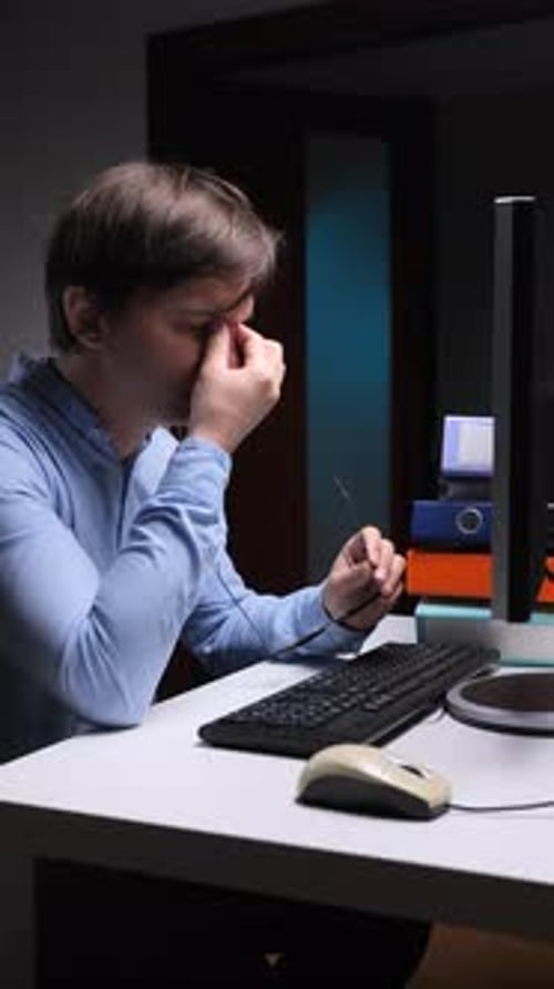 Vertical Video Stressed Office Worker Suffering From Headache and Eye Strain at Night