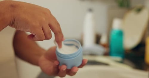 Hands, skincare and cream jar in bathroom for health, moisturizer and hydration product