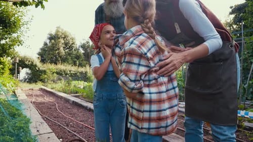 Happy Family Gardening Together in the Summer