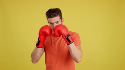 Man Bobs and Weaves Wearing Boxing Gloves