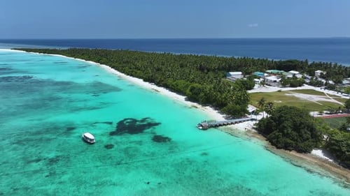 Aerial view of the island with the dock, Maldives.
