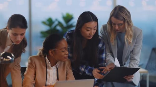 Women Collaborating in Modern Office Workplace