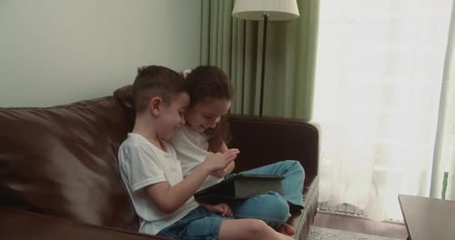 People Studying at School Learning at Home on the Tablet