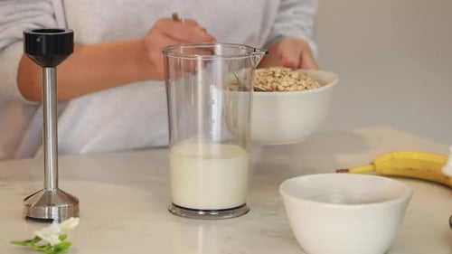 Preparing Healthy Oat and Banana Smoothie at Home