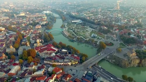Aerial View of Cityscape with Winding River