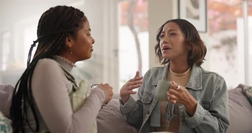 Friends Chatting and Drinking Tea at Home