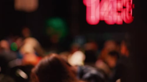 Out of Focus Crowd in Dimly Lit Restaurant