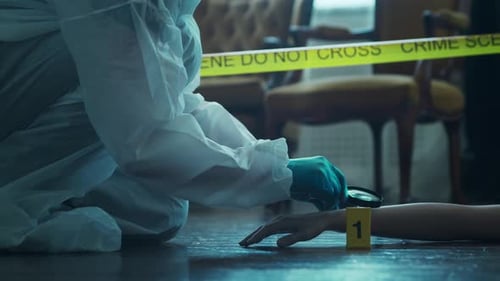 Crime Scene Investigator Examining Evidence with Magnifying Glass