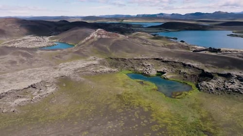 Aerial view of lakes and mountains in serene valley, Iceland.