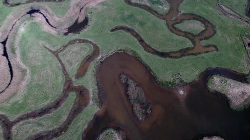 Vast Landscape Of Salt Marshes At The River Of Tollesbury Marina, Essex, United Kingdom. Aerial Tilt