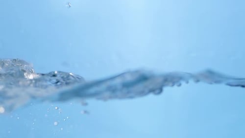 Water drops cascade in a smooth flow, creating a calming ripple effect on the surface. A perfect rep