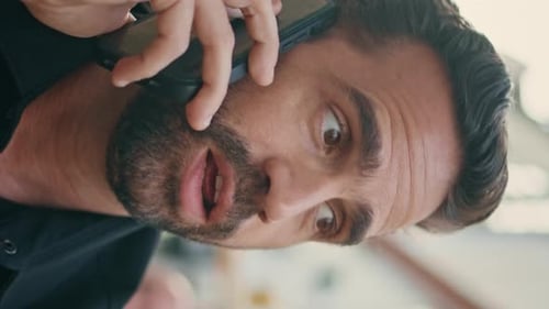 Serious Man Talking Cell Discussing at Bar Vertical Closeup Freelancer Call