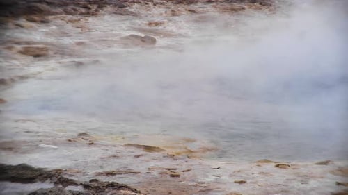 Geyser pool with steam in slow motion