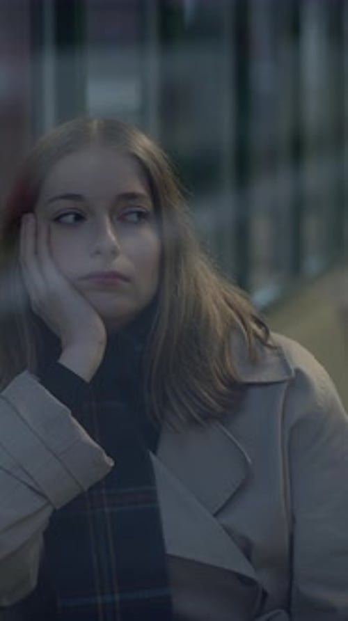 A Contemplative Young Girl Deep in Thought Gazing Out the Window with Beautiful Daylight