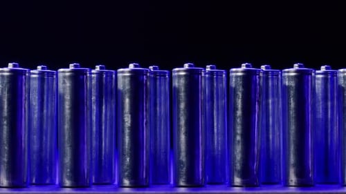 Batteries in Row Under Blue Lighting