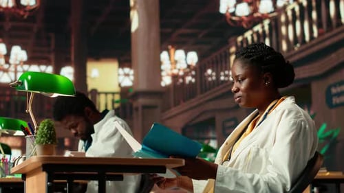 Medical Students Studying Records Inside Library