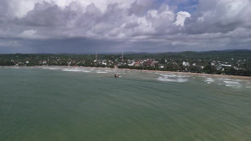 Indian Ocean south Sri Lanka sandy shore beach Asia, rainforest skyline, aerial