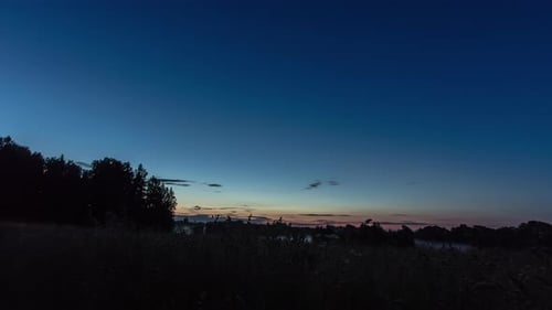 Rural Landscape at Sunrise or Sunset with Silhouetted Trees