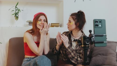 Women Chatting with Eye Masks on Video Call