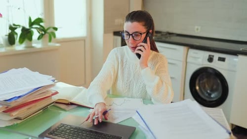 Woman Working From Home on Computer and Phone
