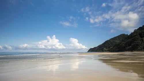 4K Timelapse of Beautiful Paradise Beach on the Island of Koh Chang, Thailand with Blue Skies.