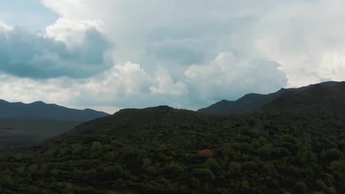 Beautiful Landscape High Mountains, Green Trees On Mountain Slopes, Clouds