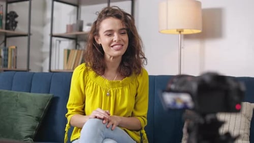 Excited Woman Waving on Camera During Live Streaming Indoor