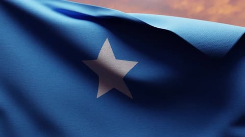 Realistic Waving Flag of Somalia Against a Sunset Sky