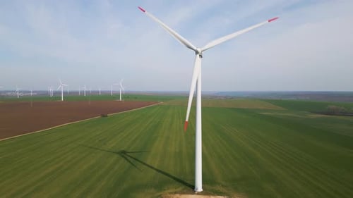 Aerial View of Wind Farm in Green Fields Renewable Energy Landscape