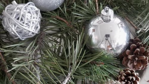 Elegant Silver and Pine Christmas Decorations for a Cozy Festive Atmosphere