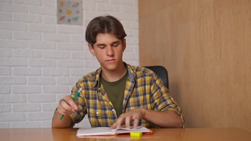 Man College Student Studying at Home Pov Sitting at Desk Listening Watching Lesson Online on