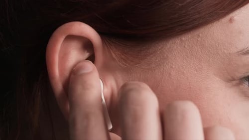 Wireless Earbud Inserted in Ear, Close Up