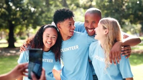 Smiling Volunteers Posing for Photo in Park