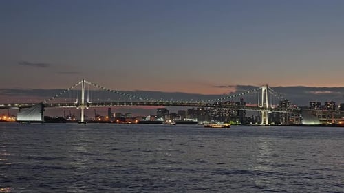 Rainbow Bridge and Tokyo Skyline from Tokyo Bay at Twilight