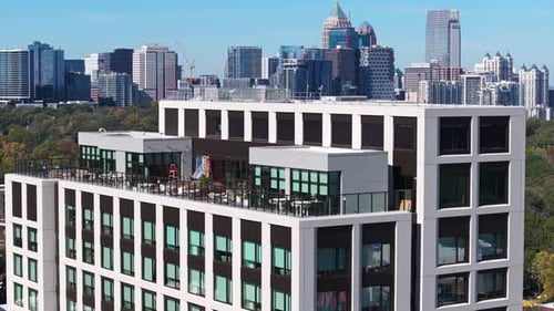 Rooftop bar cafe with Midtown Atlanta commercial and residential skyline buildings in background