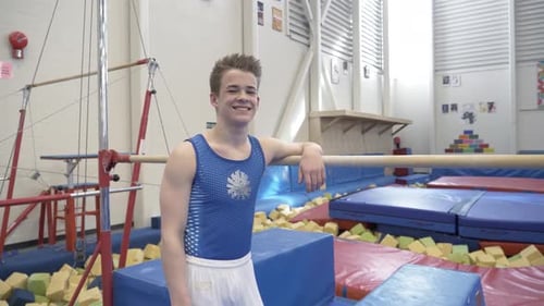Teenage Boy in Gymnasium Smiling Achievement