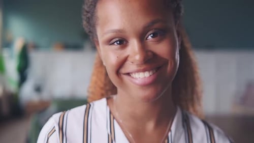 Young Woman Smiling in Close Up Portrait