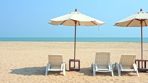 Deserted beach chairs and umbrellas during covid-19 virus pandemic and traveling restrictions, full