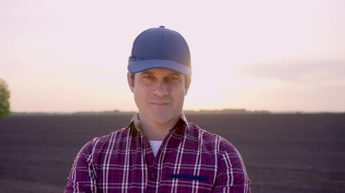 Farmer Man Portrait Looking at Camera at Field Sunset Harvesting Crop Farming