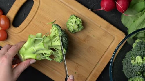 Broccoli Chopped on Wooden Cutting Board for Cooking