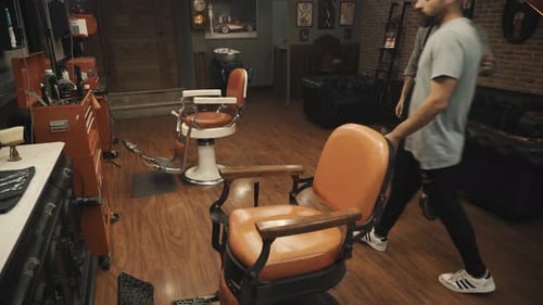 Hairstylist With A Young Client In A Barber Shop. Close Up