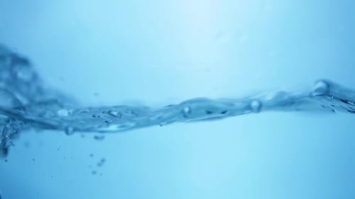 Refreshing Blue Waves. Abstract Water Background with Splashing Bubbles. View of Fresh Water Droplet