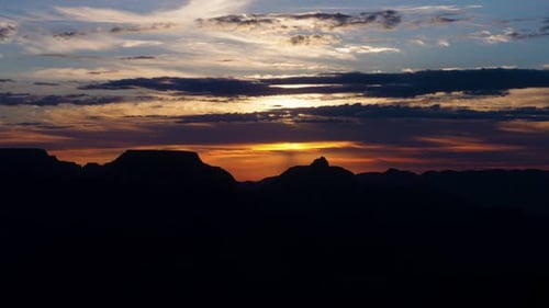 Soft Sun Light Shines Through Morning Clouds Over Grand Canyon Wilderness Time Lapse