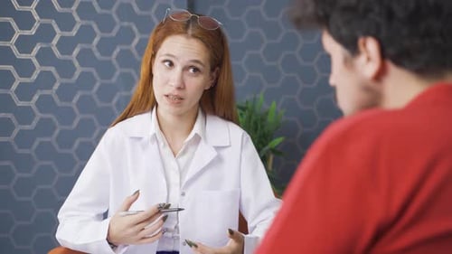 Healthcare Professional Discussing with Patient in Modern Office