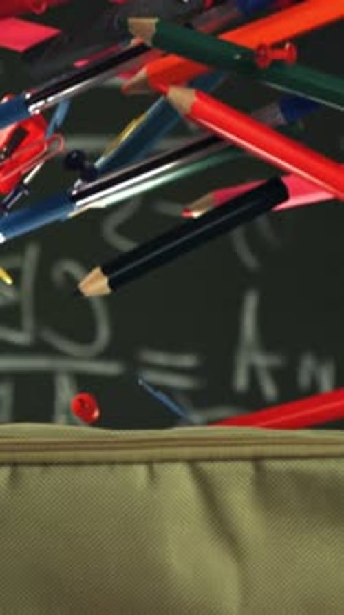 Various Accessories Fall Into the School Pencil Case Filmed on a Highspeed Camera at 1000 Fps