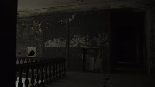 View of Old Abandoned Staircase with Wooden Railings Panning Downwards