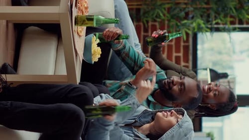 Vertical Video Diverse Friends Enjoying Comedy Movie on Tv Channel