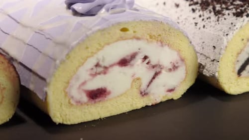 Close up detail shot of Ice cream froster swiss cake rolls collection with black background oreo bla